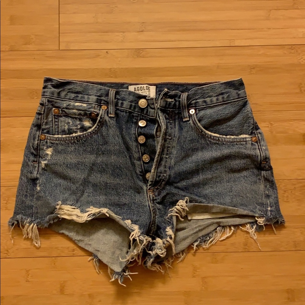 Agolde cut off shorts in darker wash.